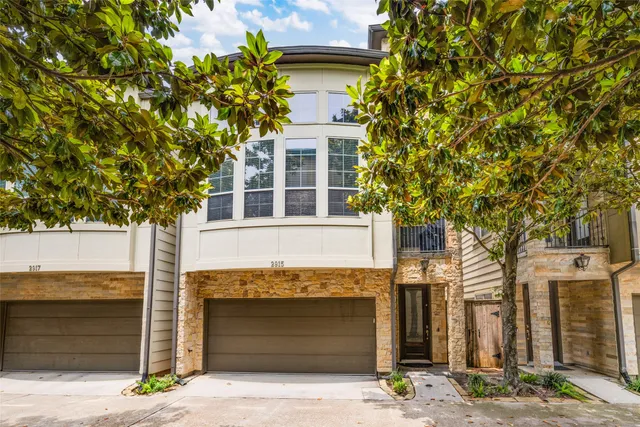 a front view of a house with garage
