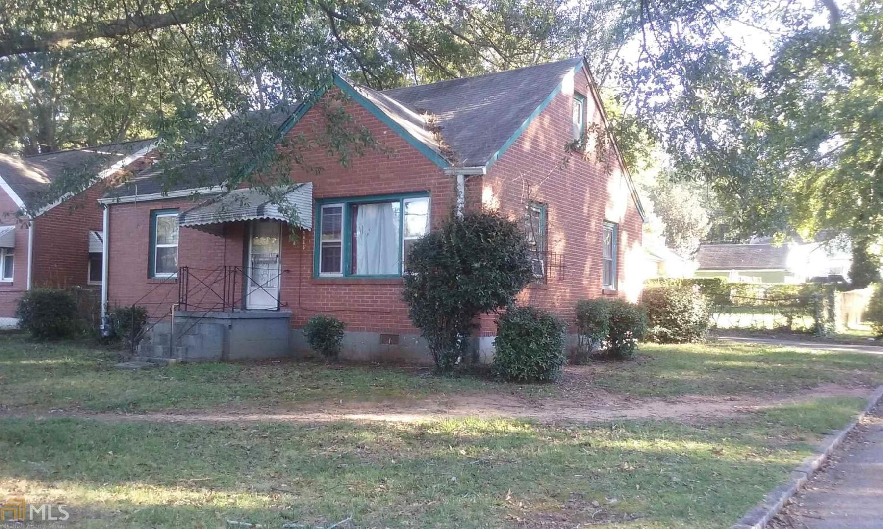 2415 Lynn Iris Drive, Unit 1 Decatur, GA 30032 - Photo 1 of 1 a front view of a house with garden