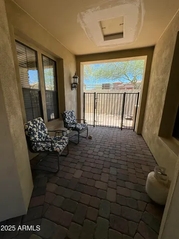 a view of a hallway with windows and entryway
