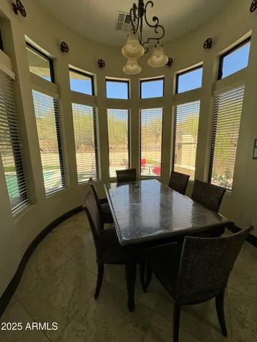 a kitchen with granite countertop a sink cabinets and stainless steel appliances