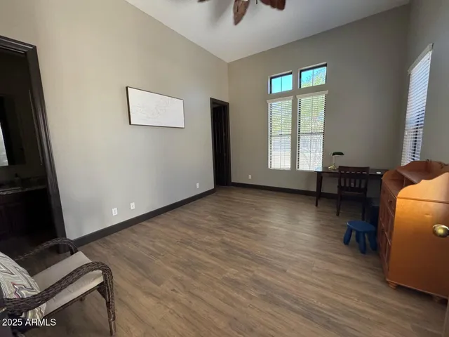 a bathroom with a granite countertop sink toilet a mirror and shower