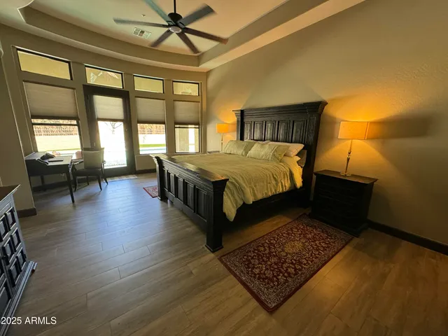 a view of room with window and wooden floor