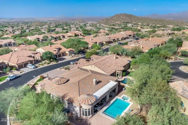 an aerial view of house yard and mountain view
