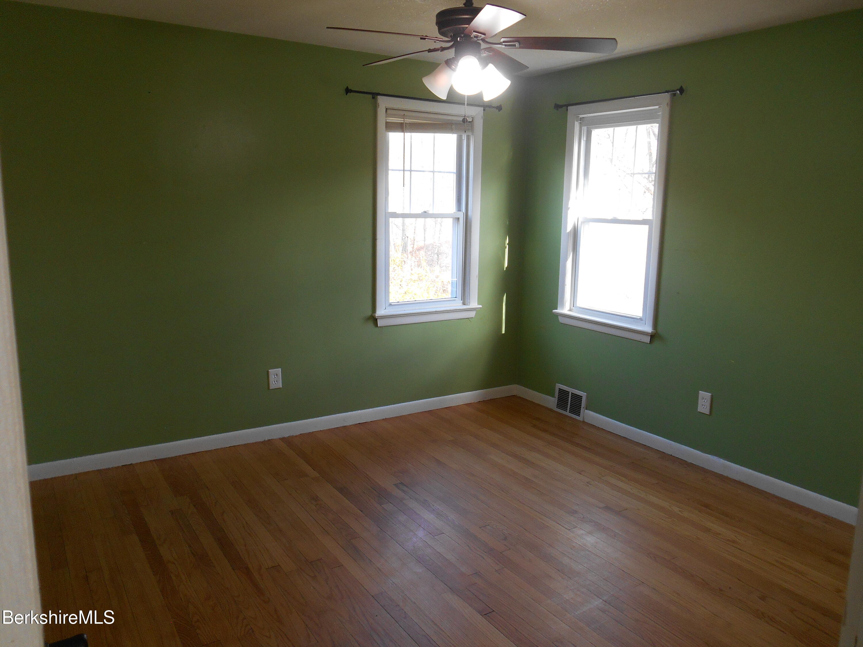 14 Glassworks Road Lanesborough, MA 01224 - Photo 11 of 23 a view of an empty room with wooden floor and a window