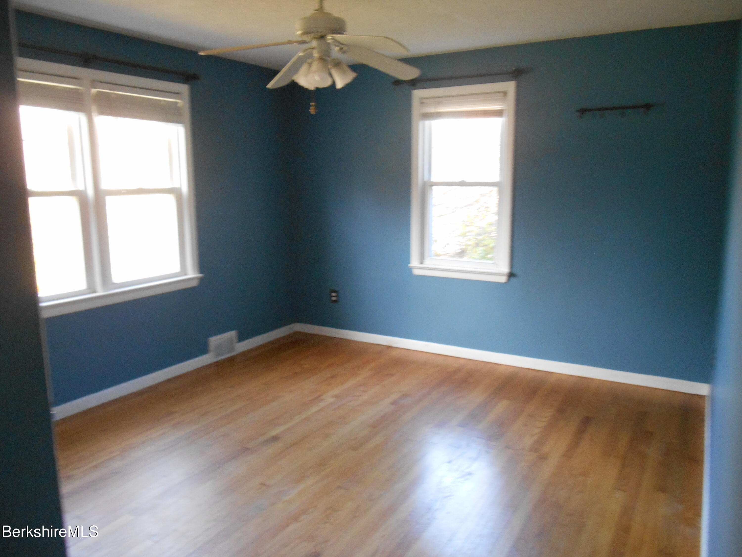 14 Glassworks Road Lanesborough, MA 01224 - Photo 13 of 23 a view of an empty room with wooden floor and a window
