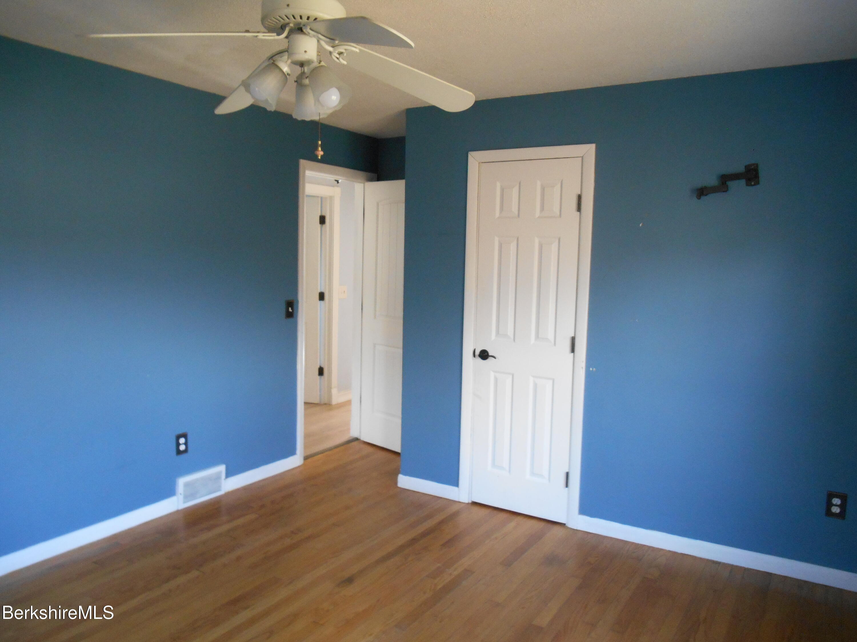 14 Glassworks Road Lanesborough, MA 01224 - Photo 14 of 23 a view of an empty room with wooden floor