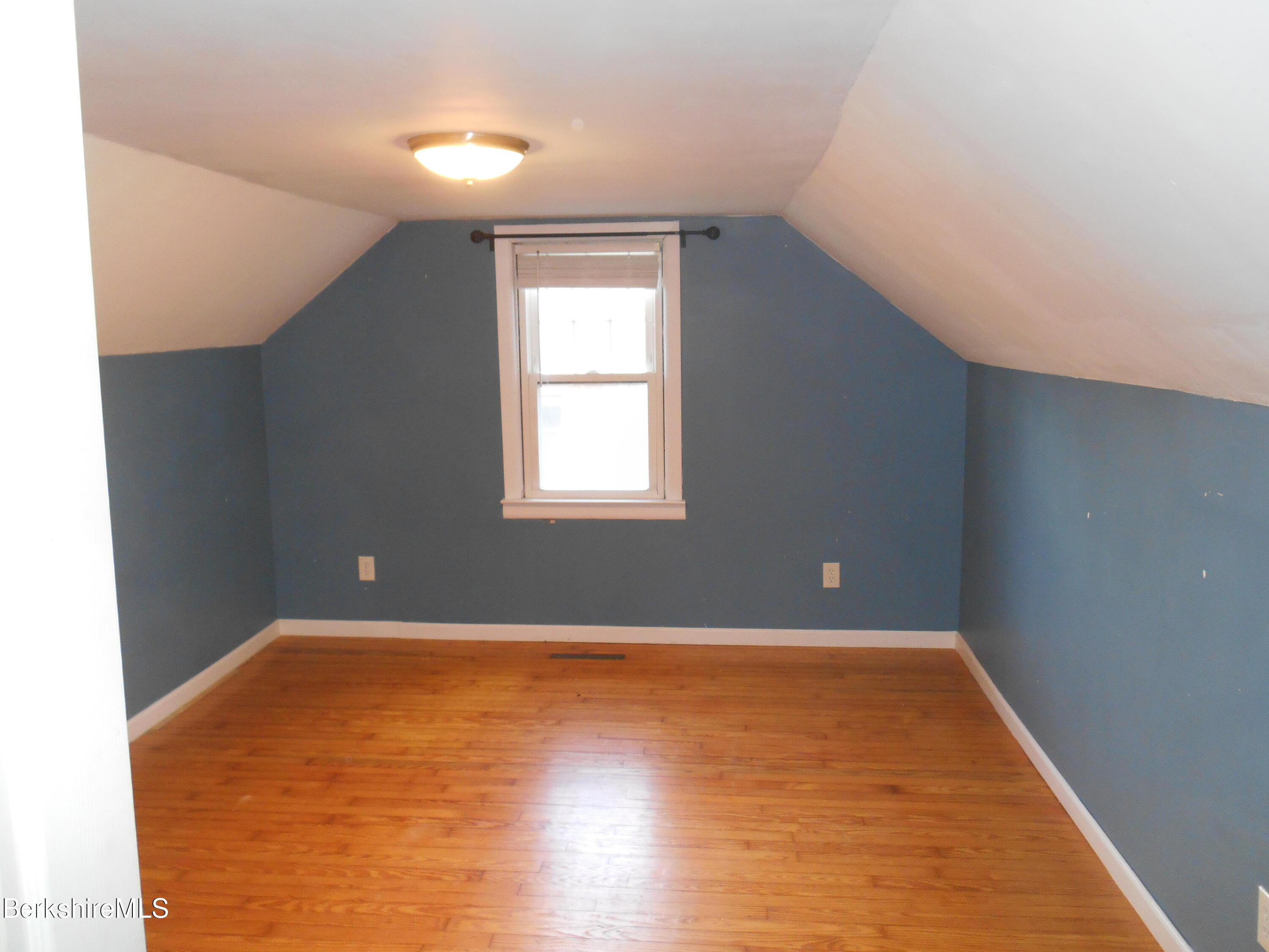 14 Glassworks Road Lanesborough, MA 01224 - Photo 15 of 23 an empty room with wooden floor and windows