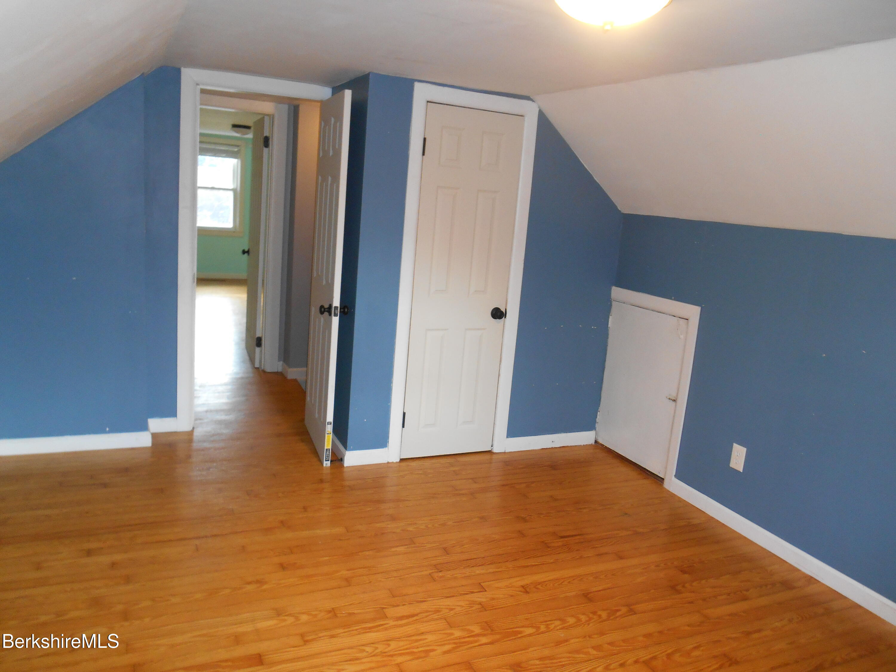 14 Glassworks Road Lanesborough, MA 01224 - Photo 16 of 23 a view of a big room with wooden floor and windows
