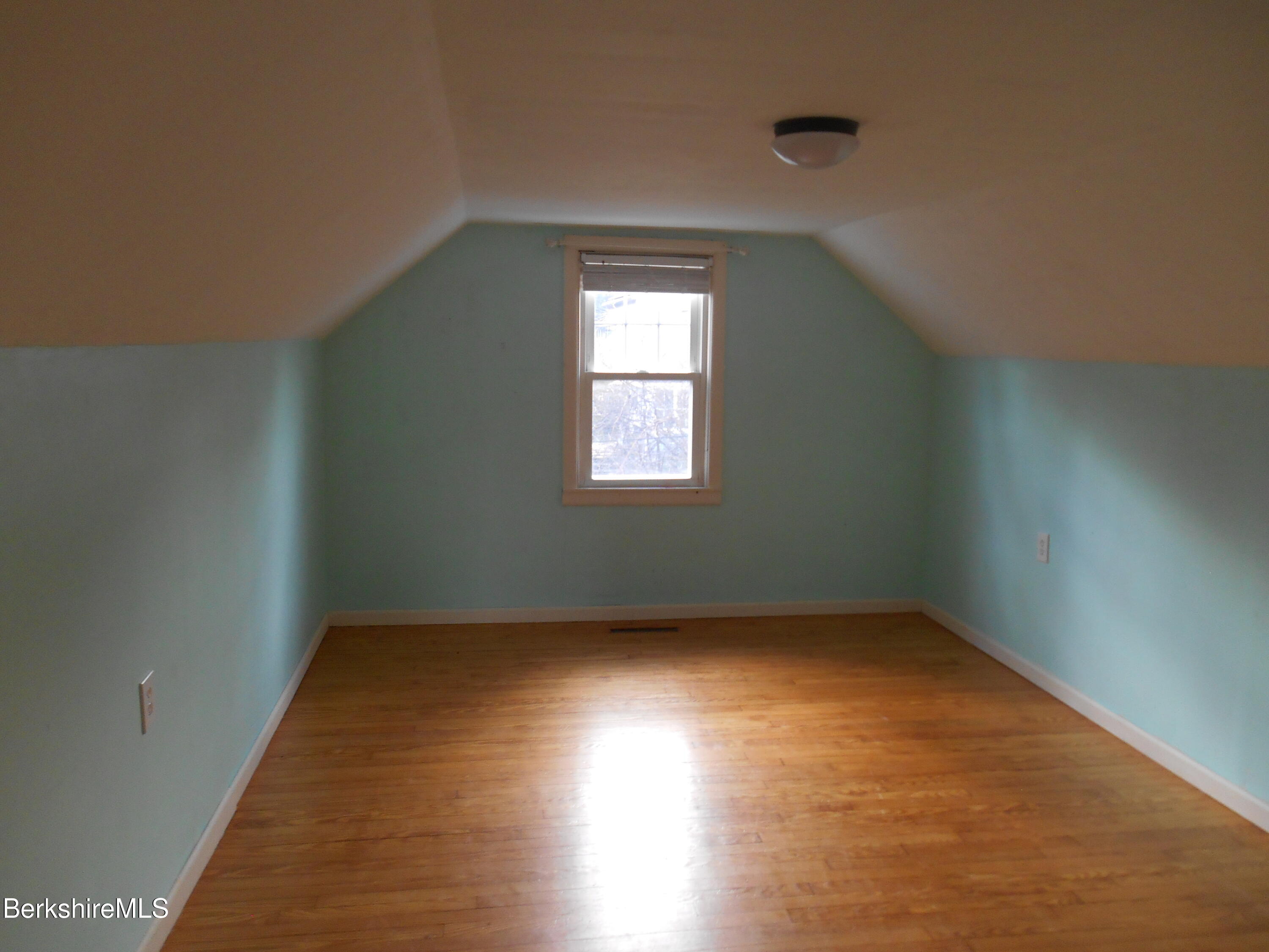 14 Glassworks Road Lanesborough, MA 01224 - Photo 17 of 23 an empty room with wooden floor and windows