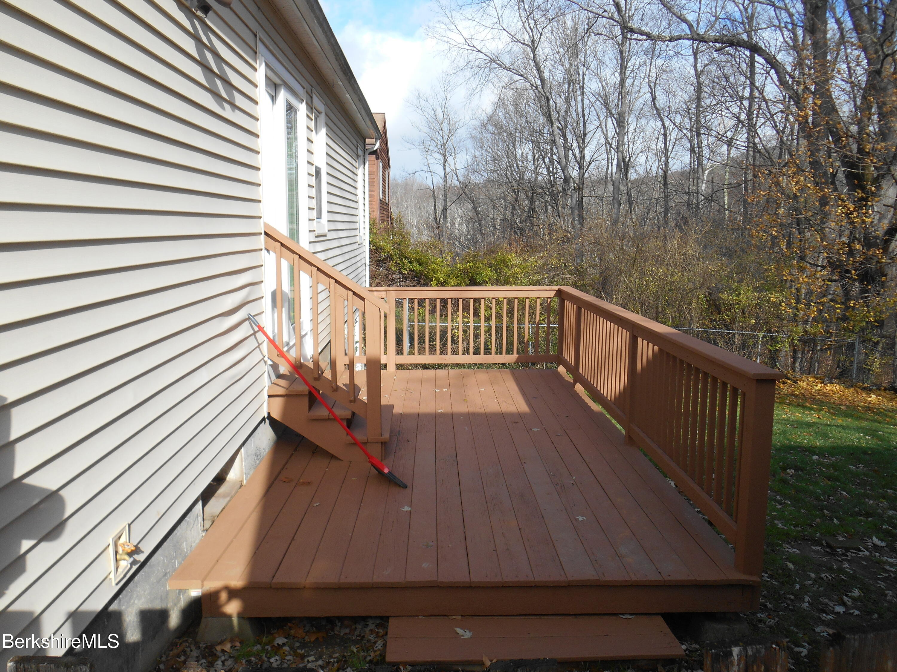 14 Glassworks Road Lanesborough, MA 01224 - Photo 2 of 23 a view of balcony with wooden floor and fence