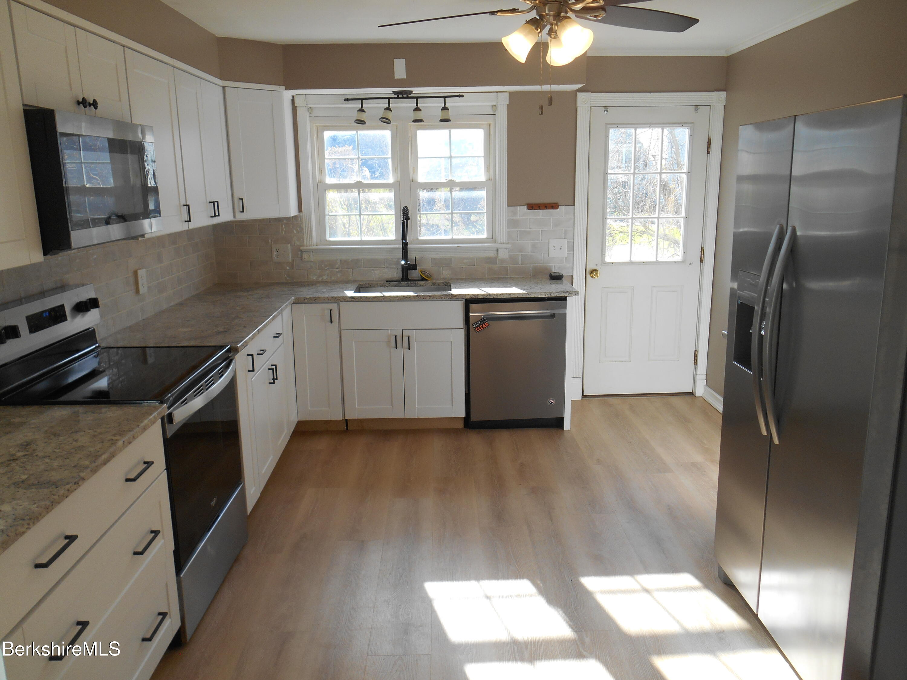 14 Glassworks Road Lanesborough, MA 01224 - Photo 5 of 23 a kitchen with granite countertop a sink stainless steel appliances and window