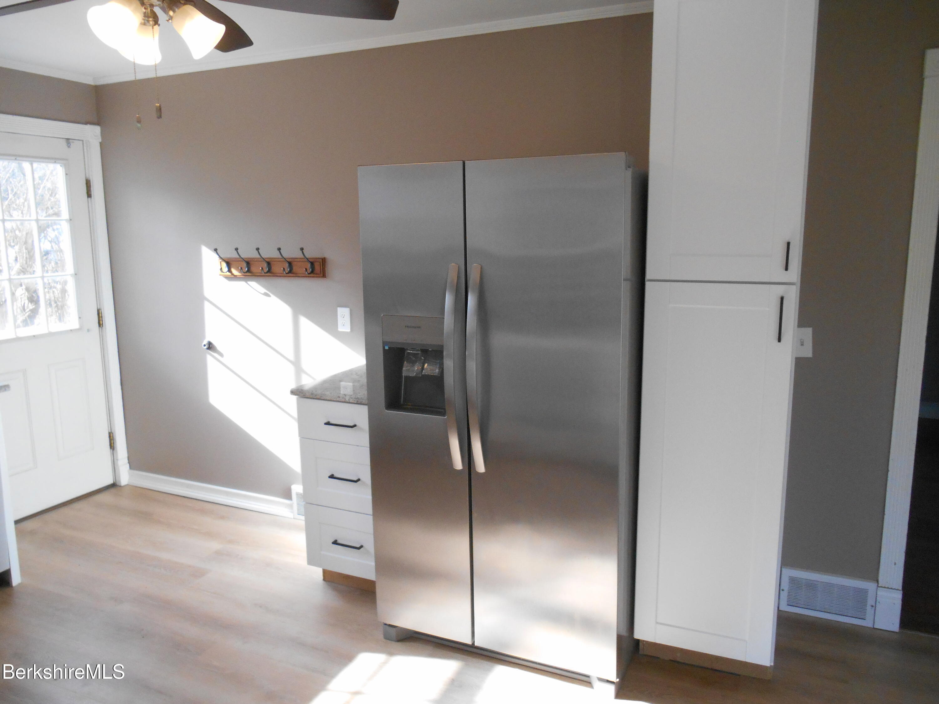 14 Glassworks Road Lanesborough, MA 01224 - Photo 6 of 23 a kitchen with a refrigerator and window
