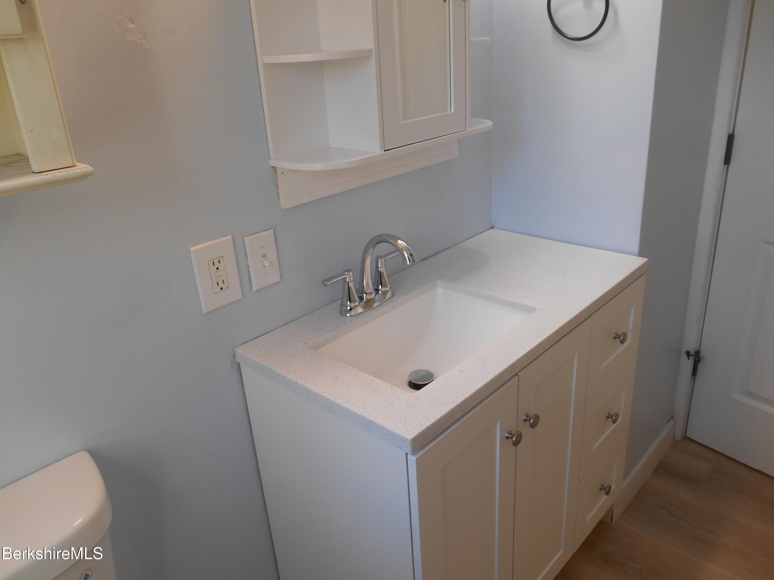 14 Glassworks Road Lanesborough, MA 01224 - Photo 10 of 23 a bathroom with a sink and a mirror