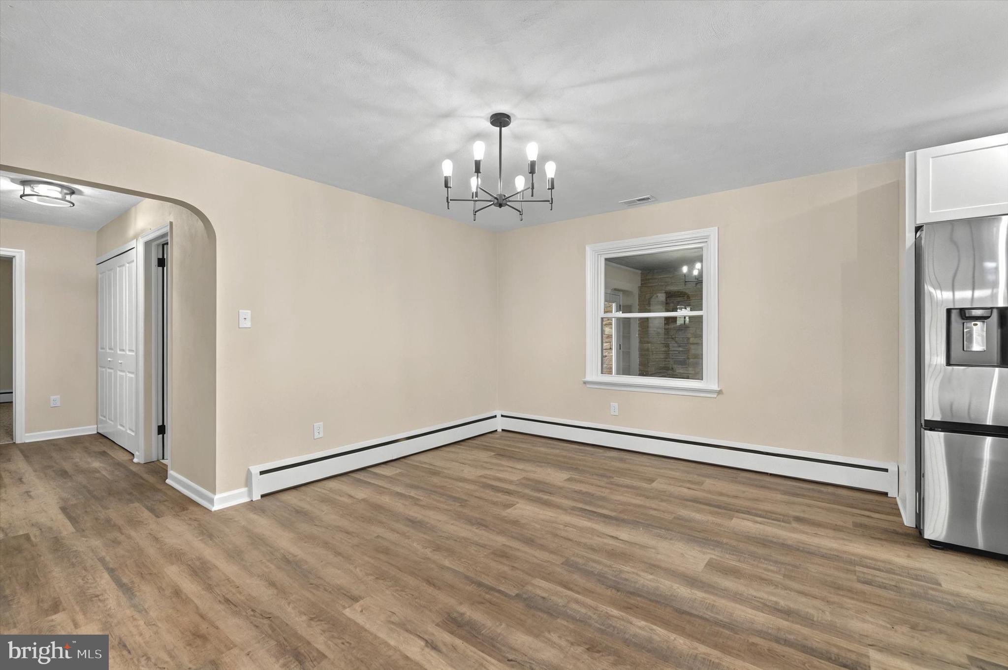 1853 Eastern Boulevard York, PA 17402 - Photo 11 of 38 a view of an empty room with wooden floor and a window