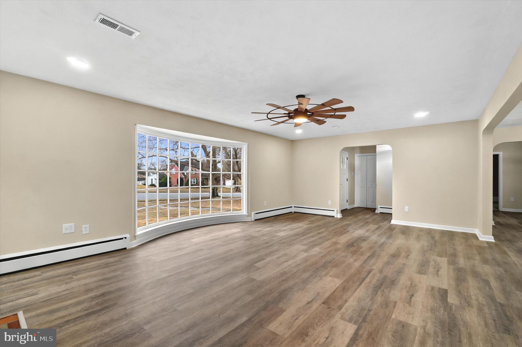 1853 Eastern Boulevard York, PA 17402 - Photo 12 of 38 a view of an empty room with a window and wooden floor
