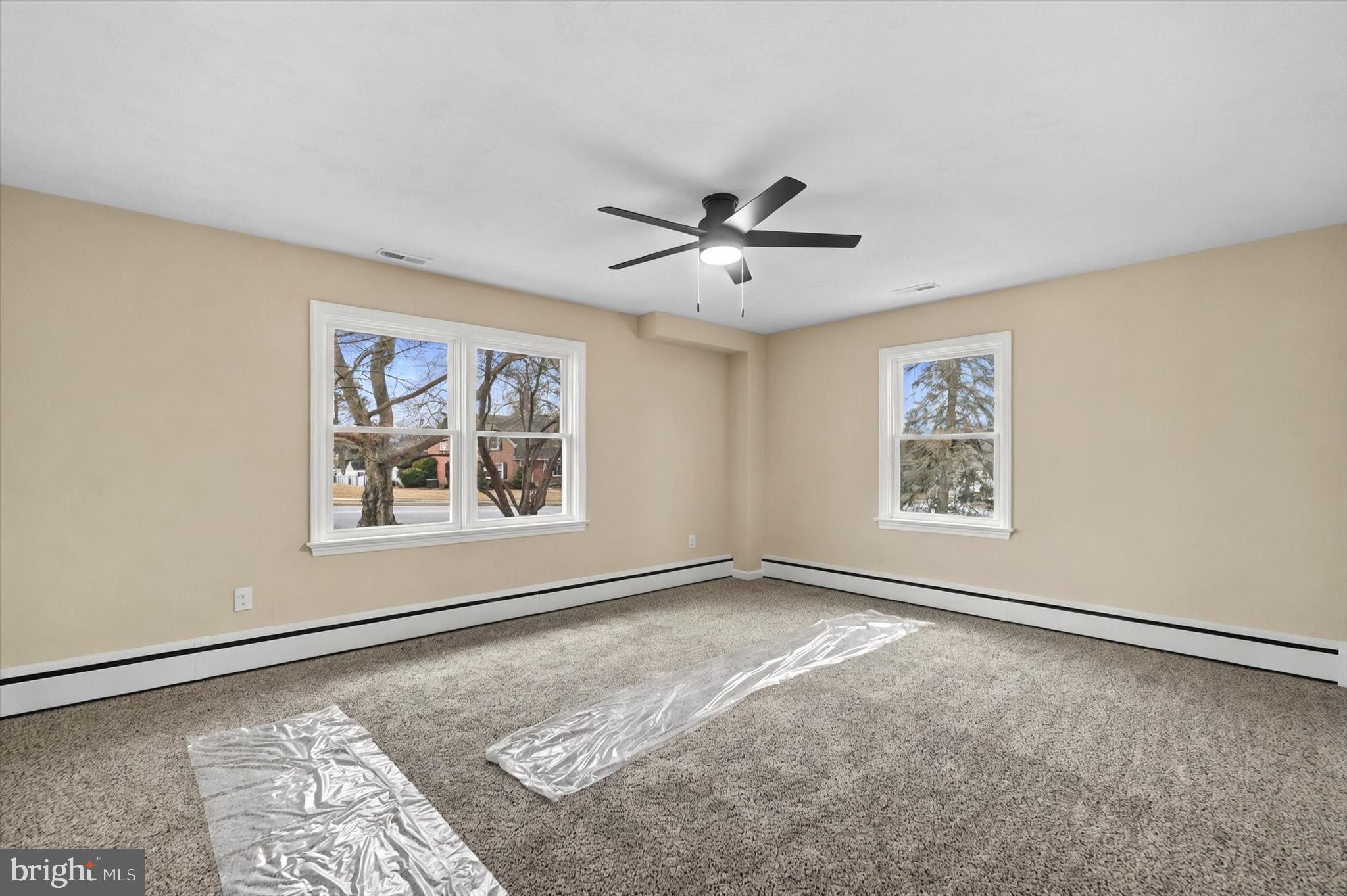 1853 Eastern Boulevard York, PA 17402 - Photo 16 of 38 a view of a big room with windows and chandelier fan