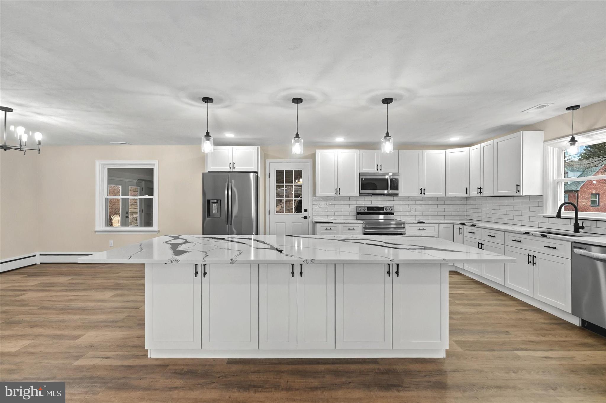 1853 Eastern Boulevard York, PA 17402 - Photo 2 of 38 a large kitchen with cabinets and wooden floor