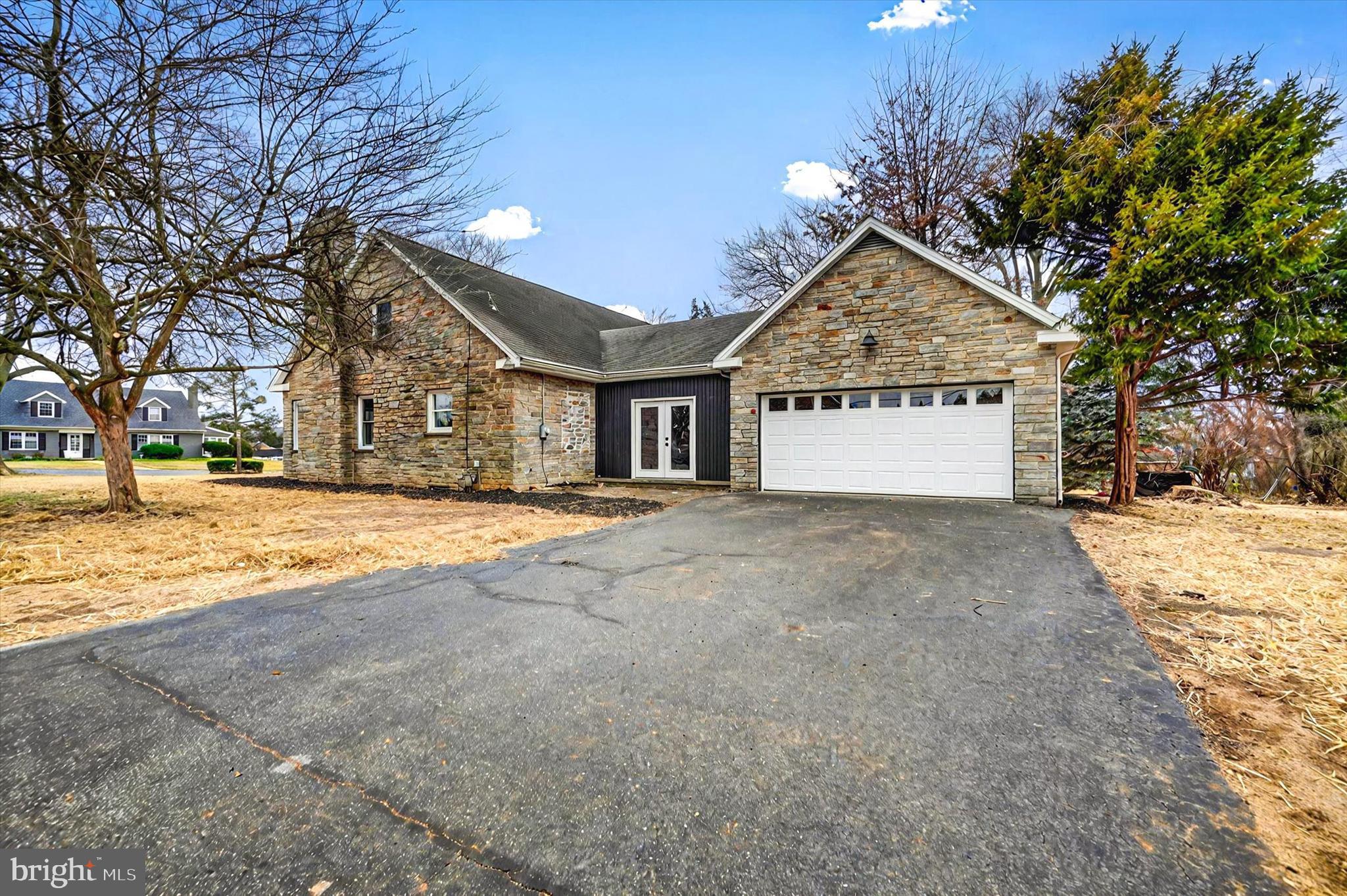 1853 Eastern Boulevard York, PA 17402 - Photo 36 of 38 a view of large white house with a yard covered with tall trees