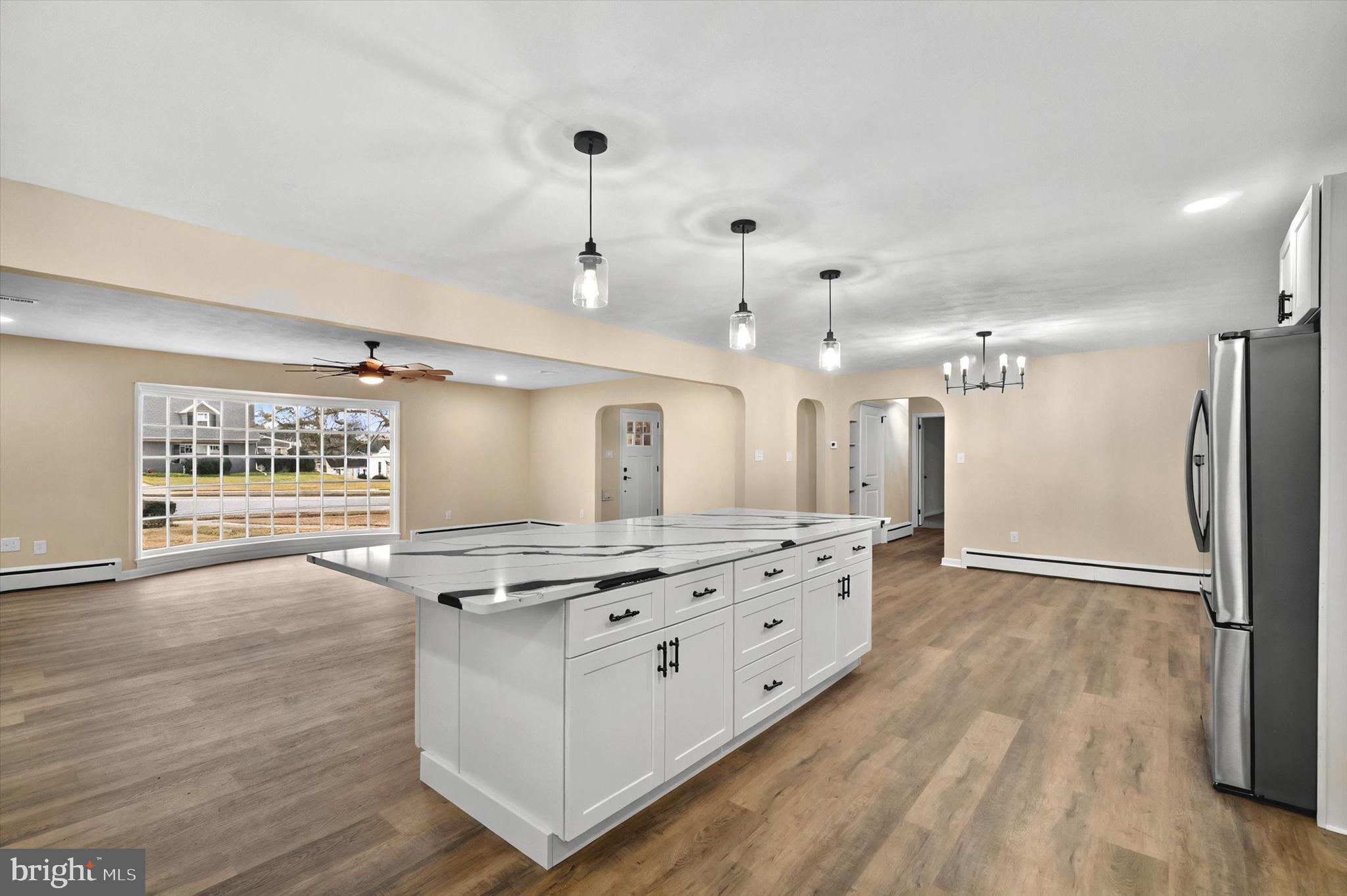 1853 Eastern Boulevard York, PA 17402 - Photo 4 of 38 a view of kitchen with stainless steel appliances granite countertop a stove a refrigerator and a wooden floors