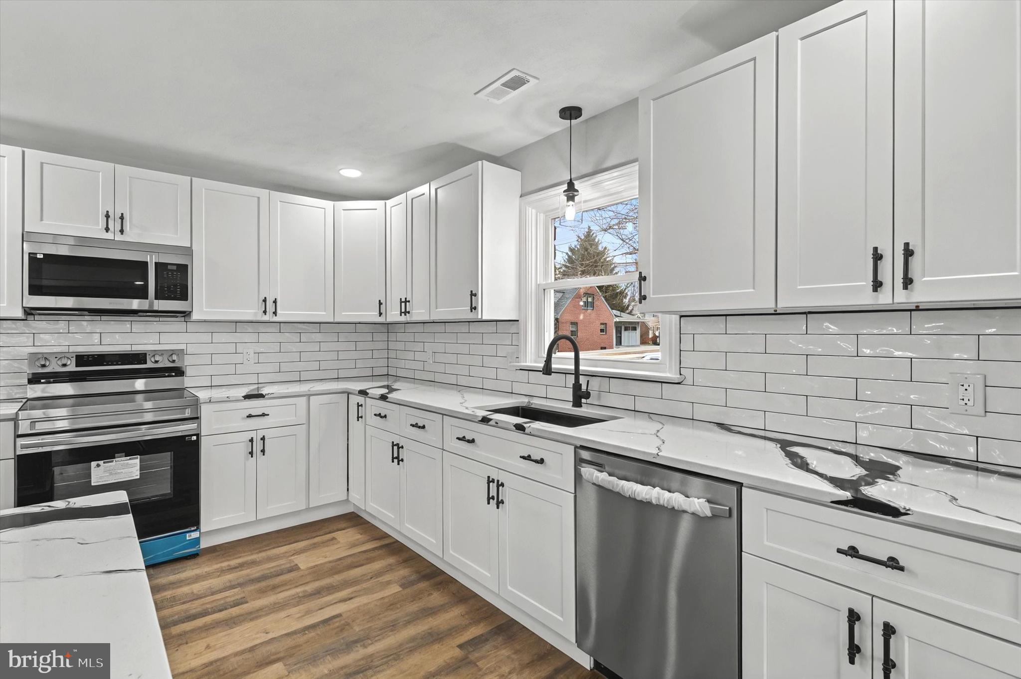 1853 Eastern Boulevard York, PA 17402 - Photo 7 of 38 a kitchen with appliances cabinets and a sink
