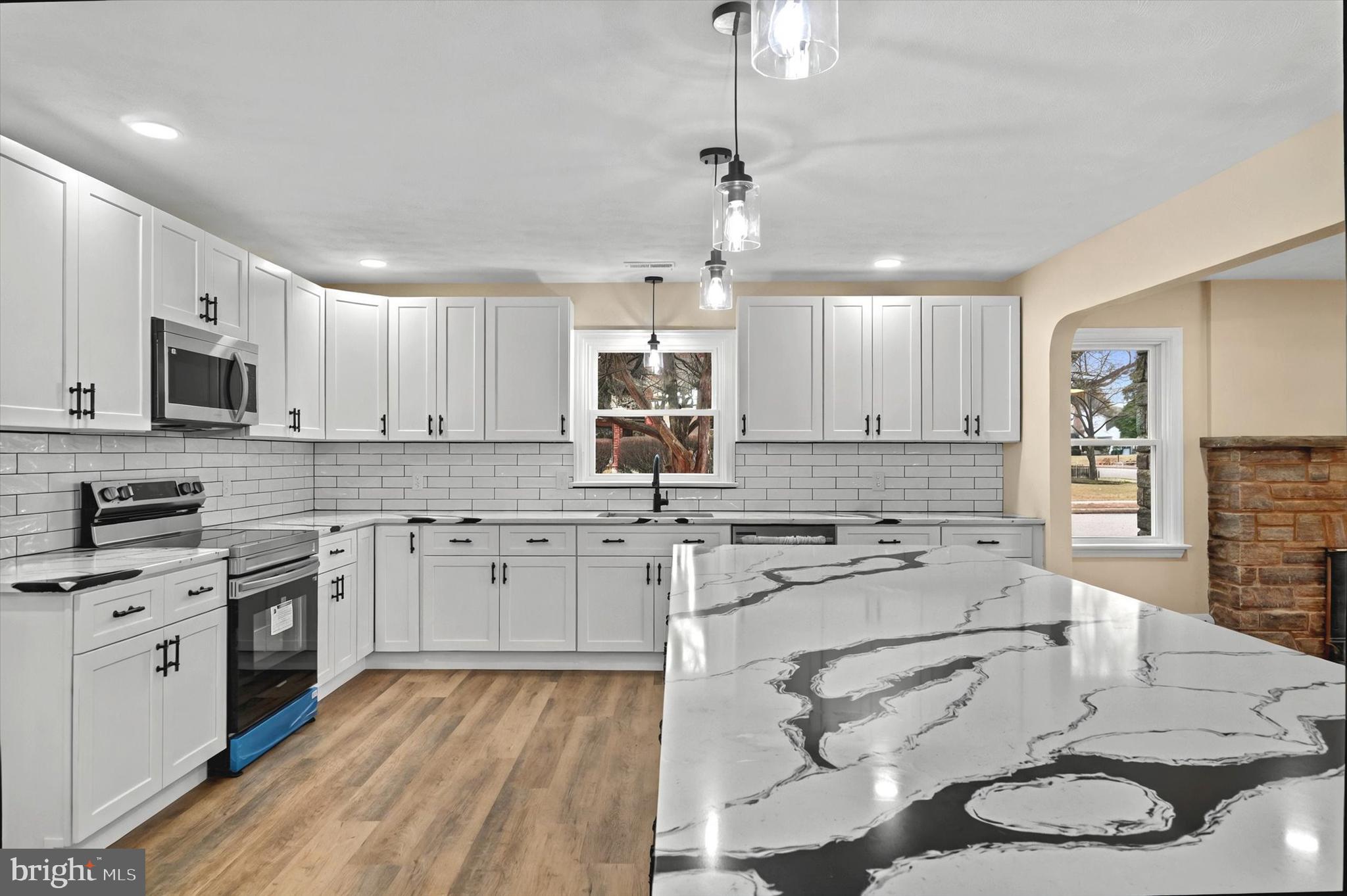 1853 Eastern Boulevard York, PA 17402 - Photo 8 of 38 a kitchen with a stove sink cabinets and refrigerator