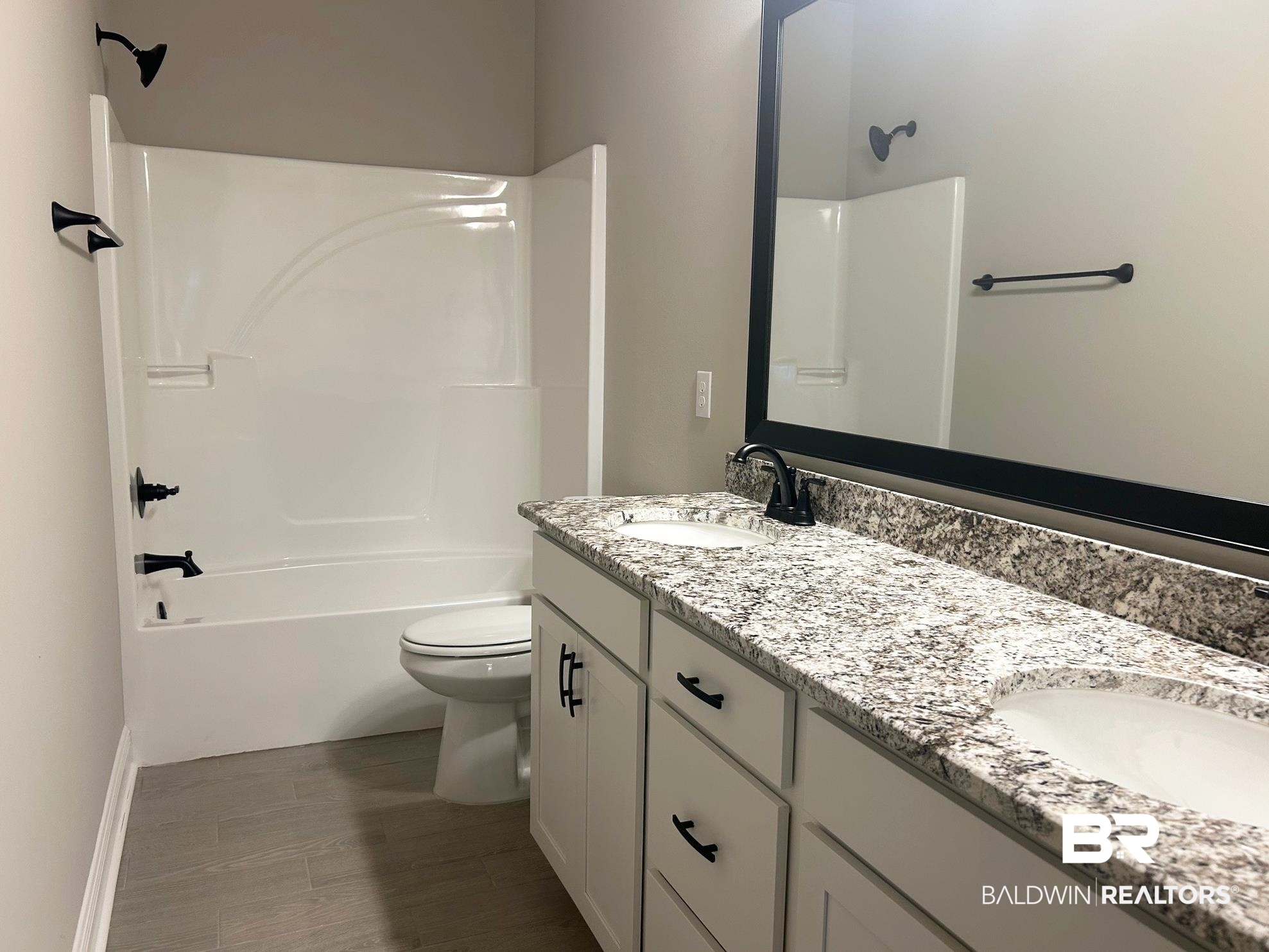 881 Sumter Loop Foley, AL 36535 - Photo 14 of 19 Full bathroom featuring vanity, shower / bath combination, toilet, and hardwood / wood-style flooring