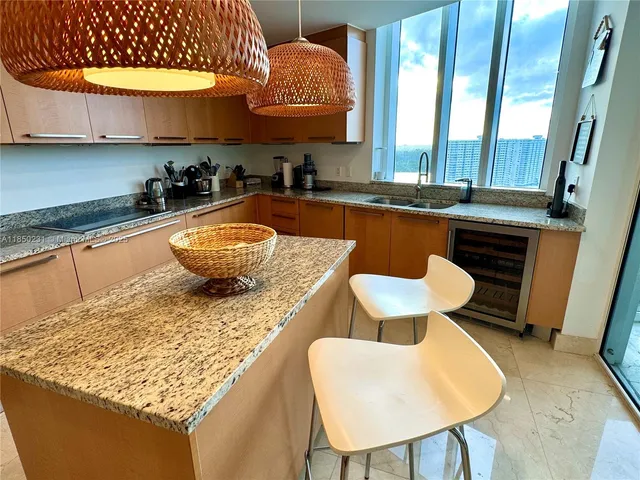 a stove top oven sitting inside of a kitchen