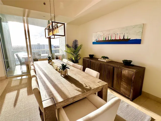 a view of a living room and kitchen with a tub