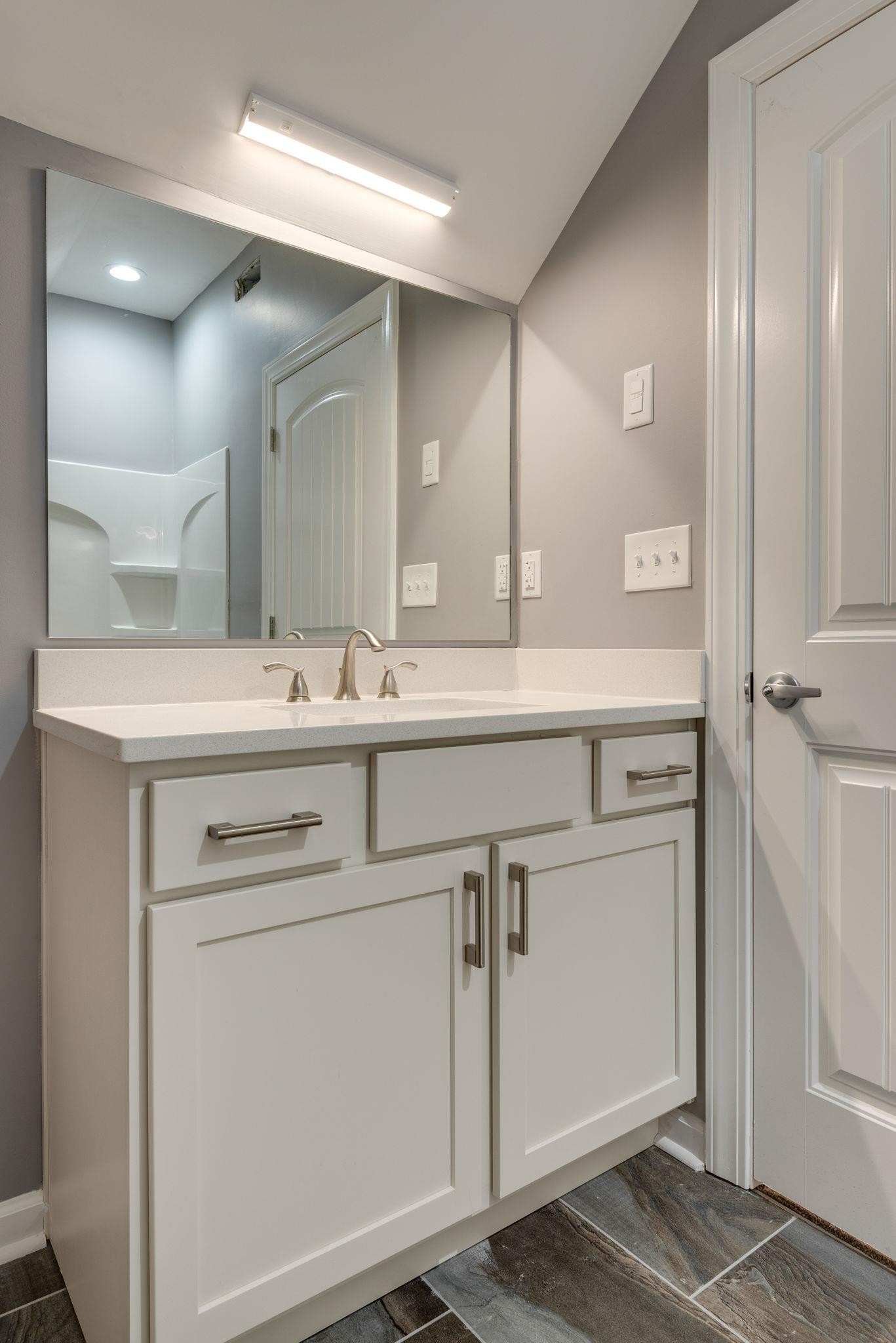 1012 Cheatham Street Springfield, TN 37172 - Photo 12 of 25 a bathroom with a sink and a mirror