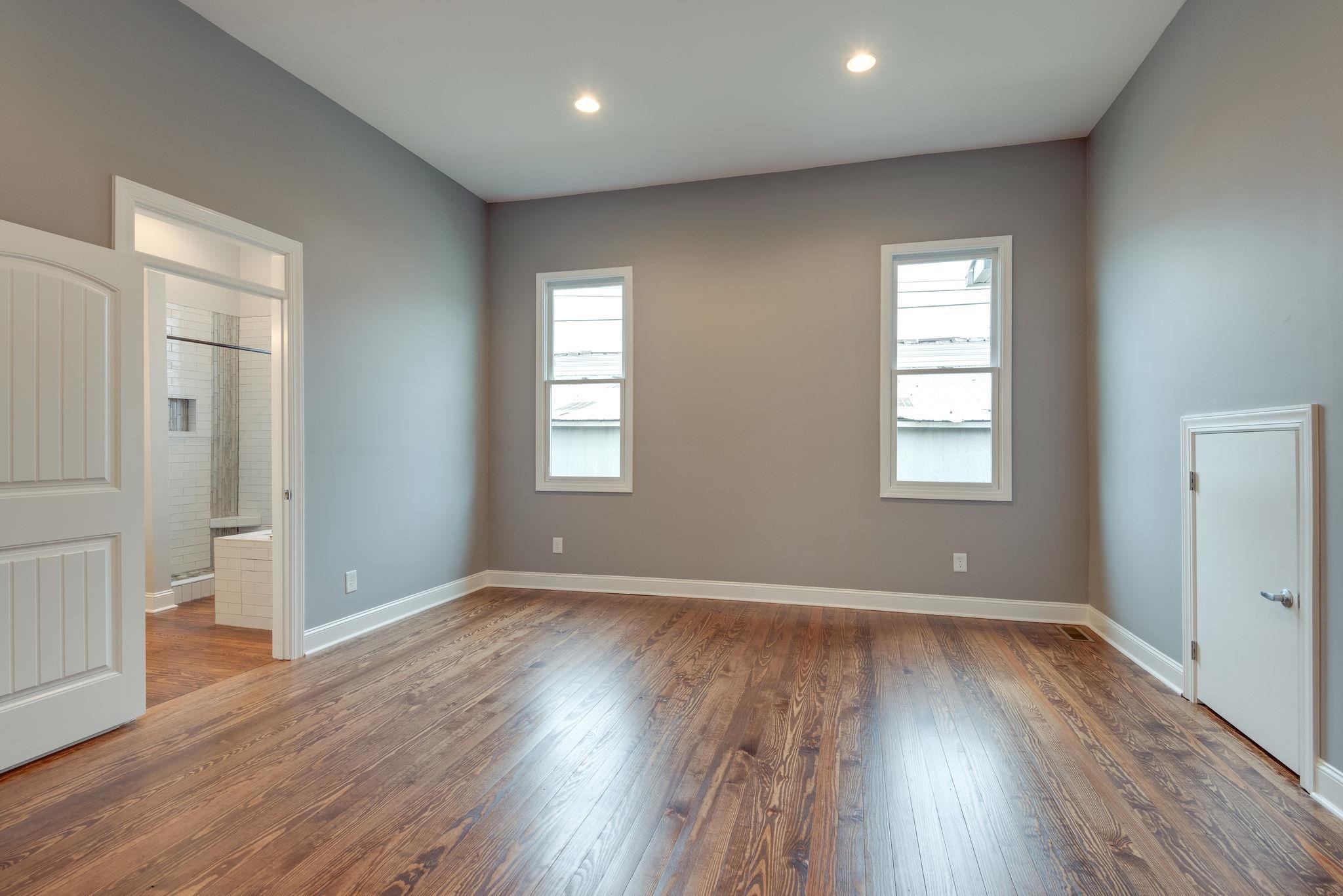 1012 Cheatham Street Springfield, TN 37172 - Photo 17 of 25 an empty room with wooden floor and windows