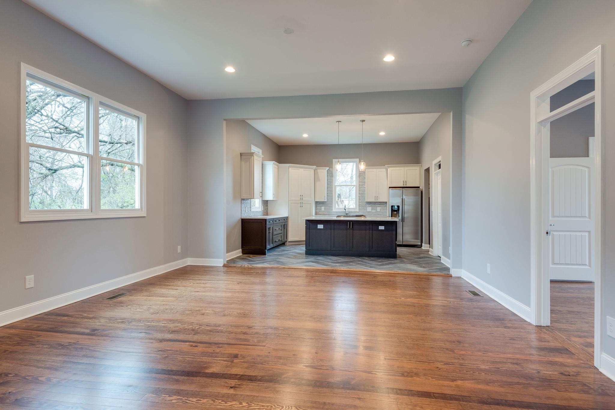 1012 Cheatham Street Springfield, TN 37172 - Photo 2 of 25 an empty room with wooden floor and windows