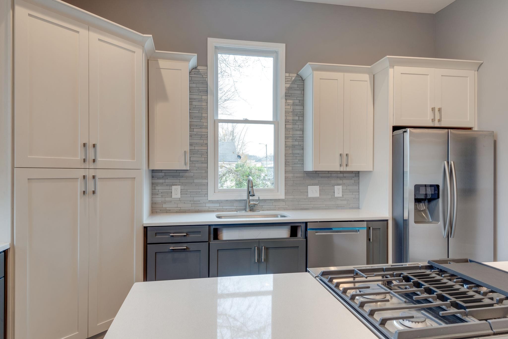 1012 Cheatham Street Springfield, TN 37172 - Photo 5 of 25 a kitchen with stainless steel appliances granite countertop a sink stove and refrigerator