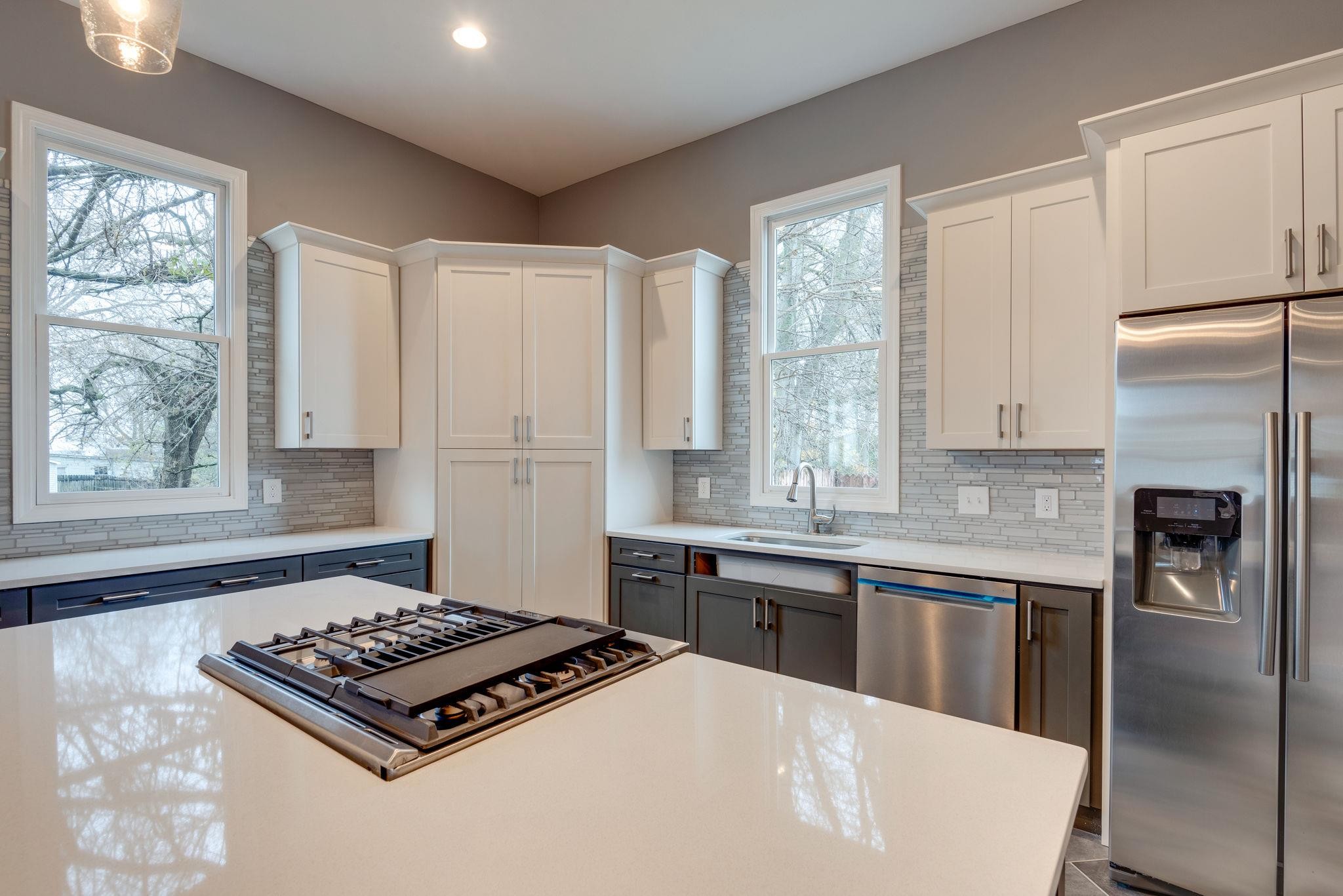 1012 Cheatham Street Springfield, TN 37172 - Photo 6 of 25 a kitchen with kitchen island white cabinets and refrigerator