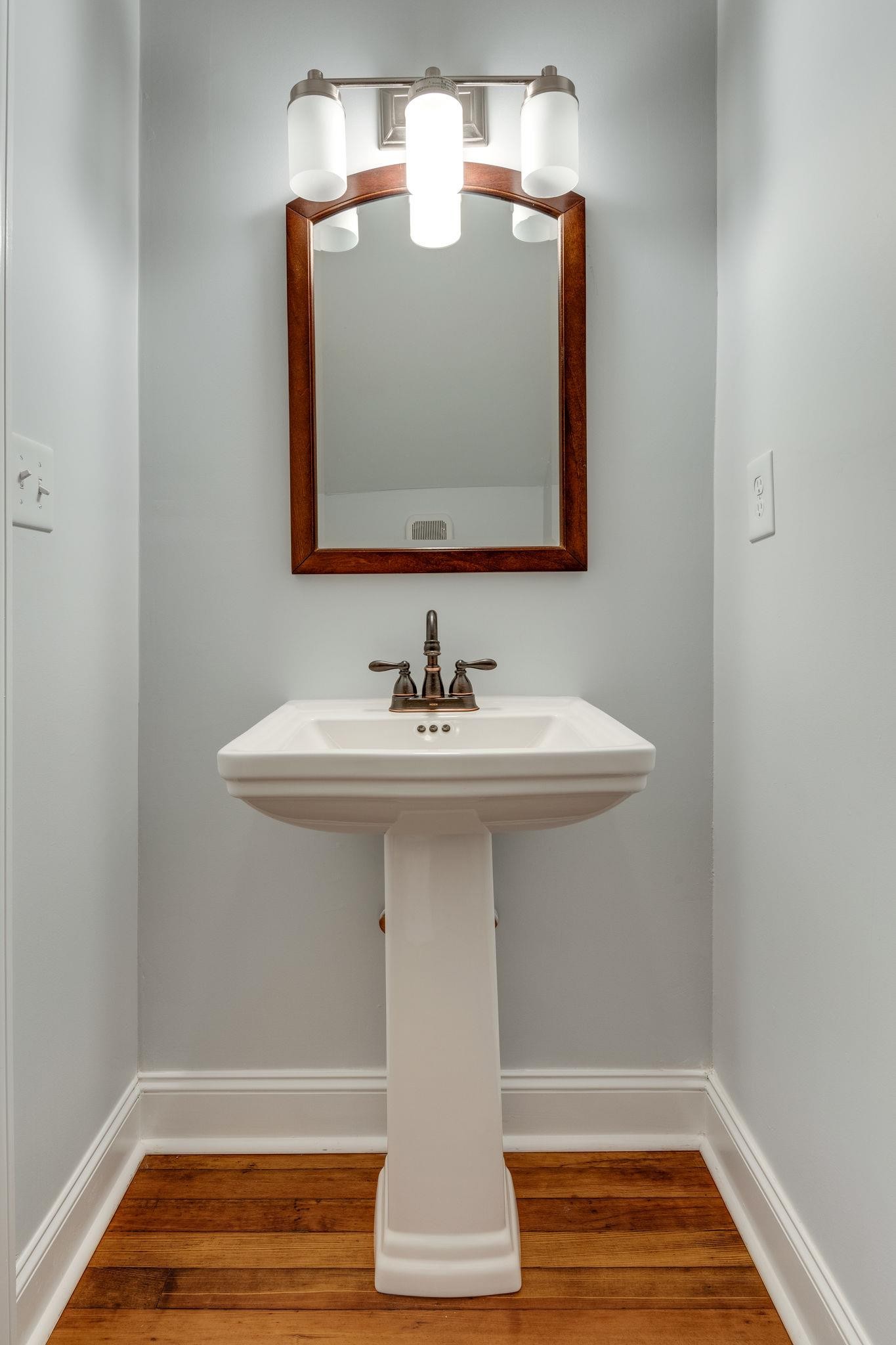 1012 Cheatham Street Springfield, TN 37172 - Photo 7 of 25 a bathroom with a sink and a mirror