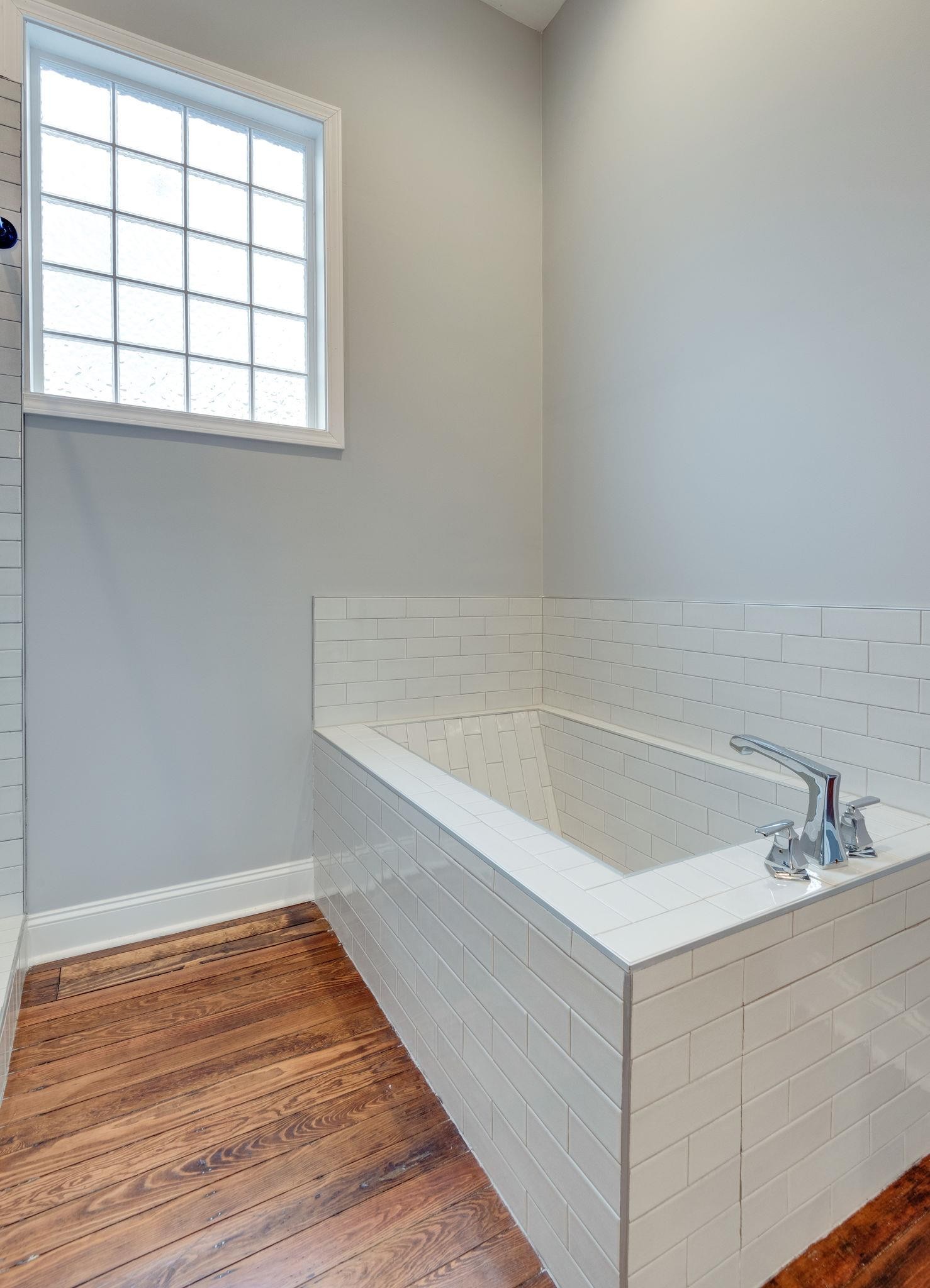 1012 Cheatham Street Springfield, TN 37172 - Photo 9 of 25 a bathroom with a sink and a bathtub
