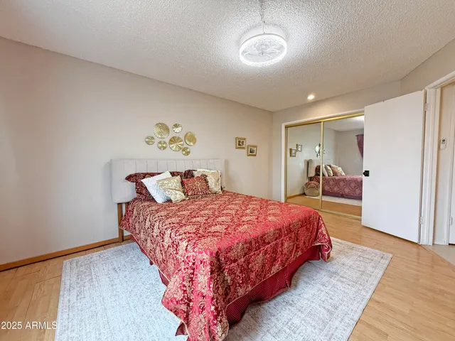 a bedroom with a bed and a table