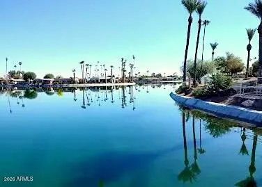 a view of a lake with sitting area