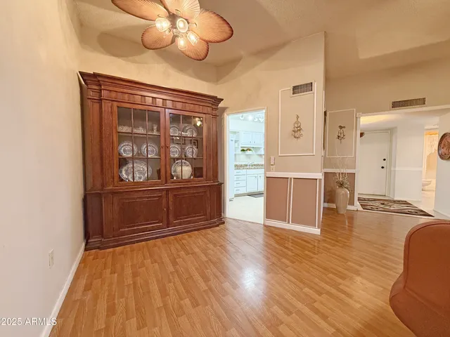 a view of kitchen with furniture and wooden floor