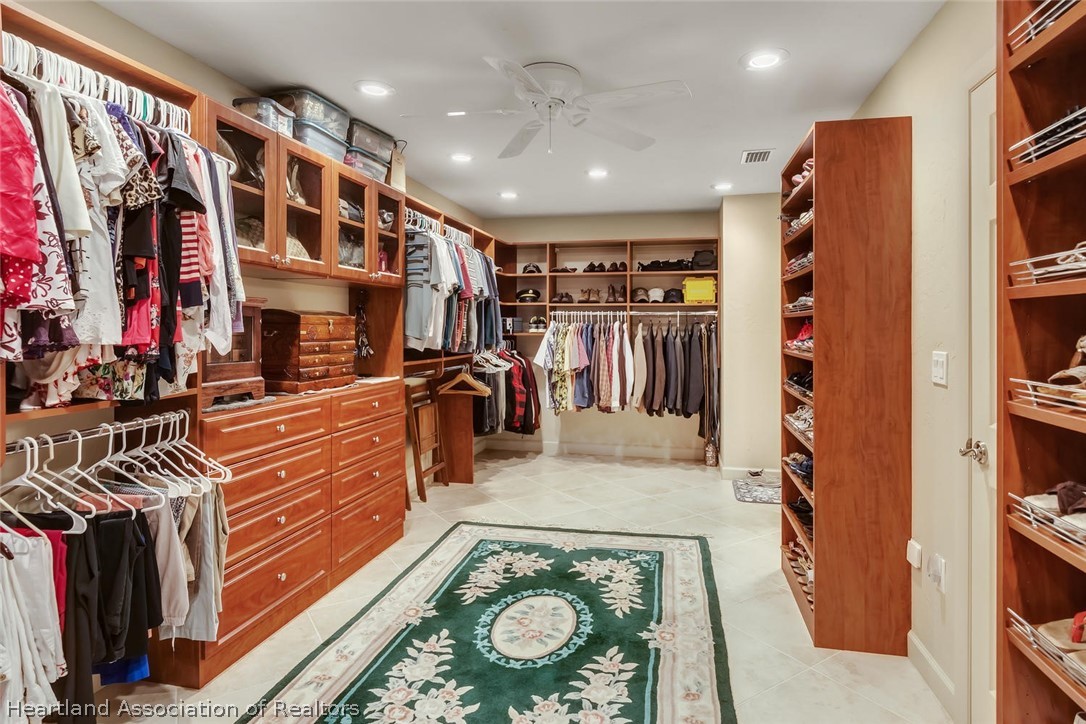 3800 Par Road Sebring, FL 33872 - Photo 15 of 24 a view of walk in closet with clothes and shoes