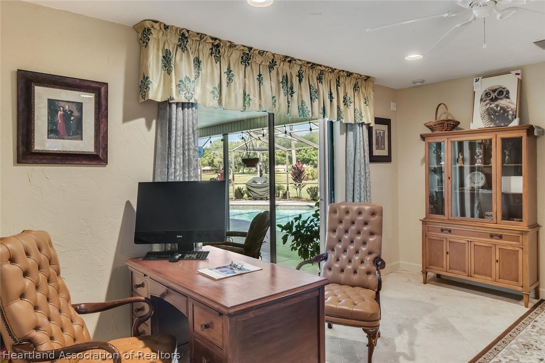 3800 Par Road Sebring, FL 33872 - Photo 17 of 24 a view of a workspace with furniture and a window
