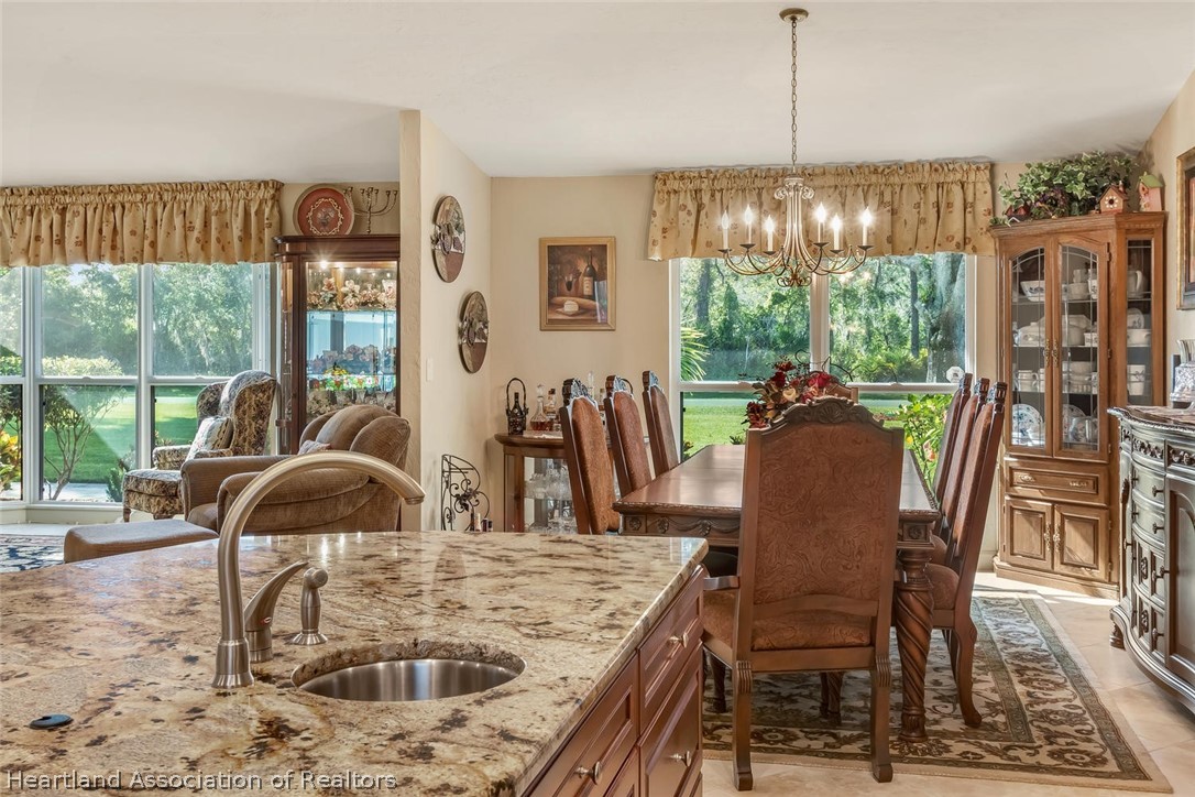 3800 Par Road Sebring, FL 33872 - Photo 8 of 24 a view of a dining room with furniture window and outside view