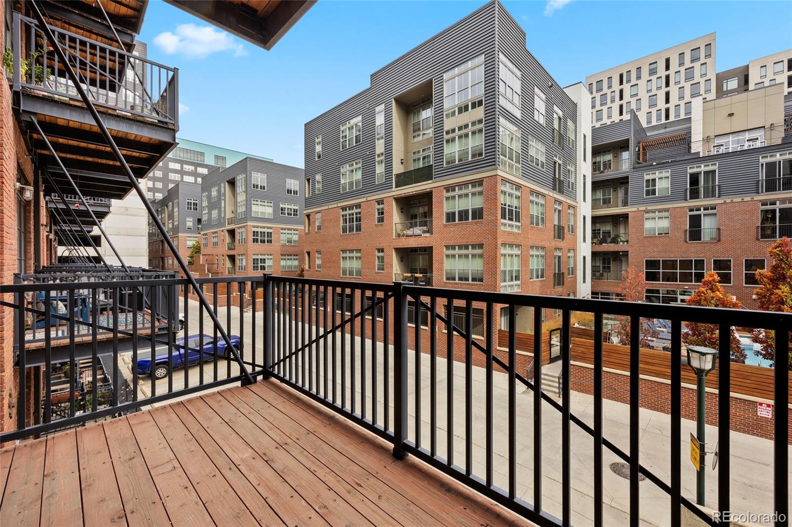 2960 Inca Street, Unit 208 Denver, CO 80202 - Photo 14 of 43 a view of a balcony with wooden floor