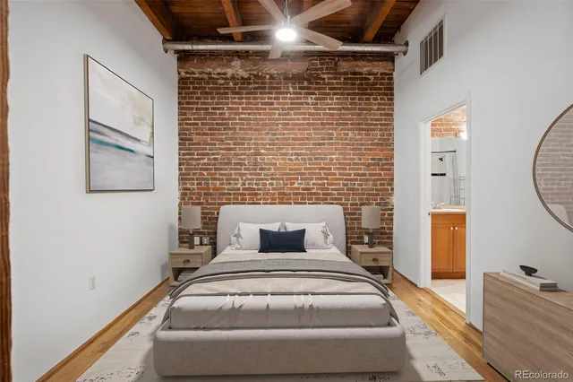 a view of empty room with wooden floor and door