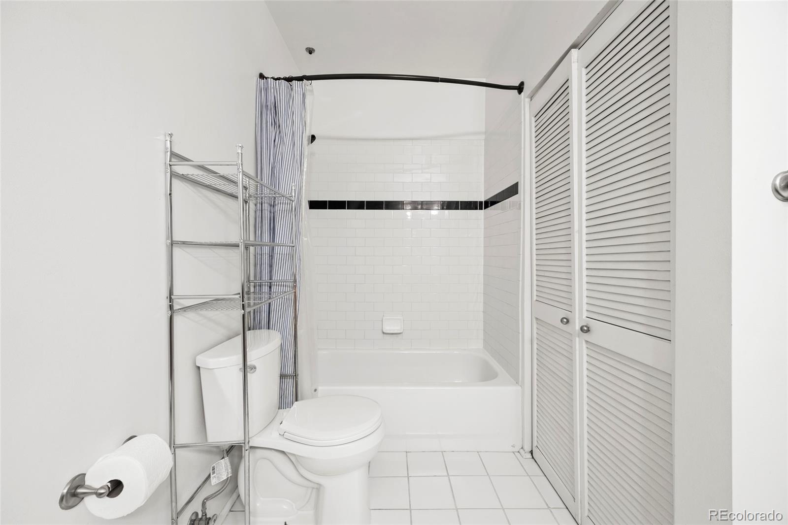 2960 Inca Street, Unit 208 Denver, CO 80202 - Photo 26 of 43 a bathroom with a toilet and a shower