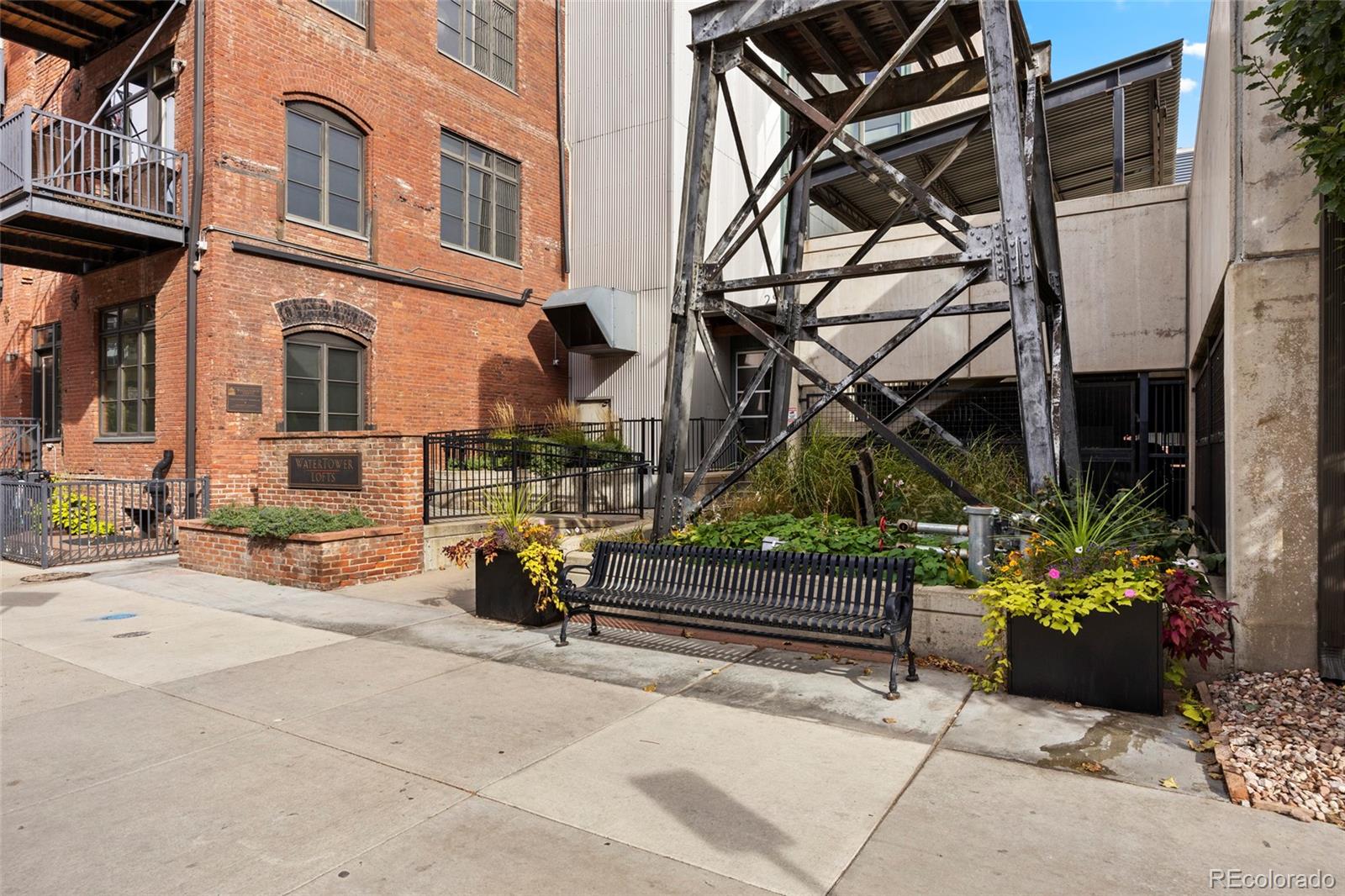2960 Inca Street, Unit 208 Denver, CO 80202 - Photo 32 of 43 front view of a building with a bench