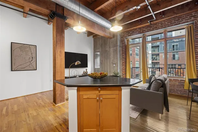 a kitchen with a sink and a refrigerator