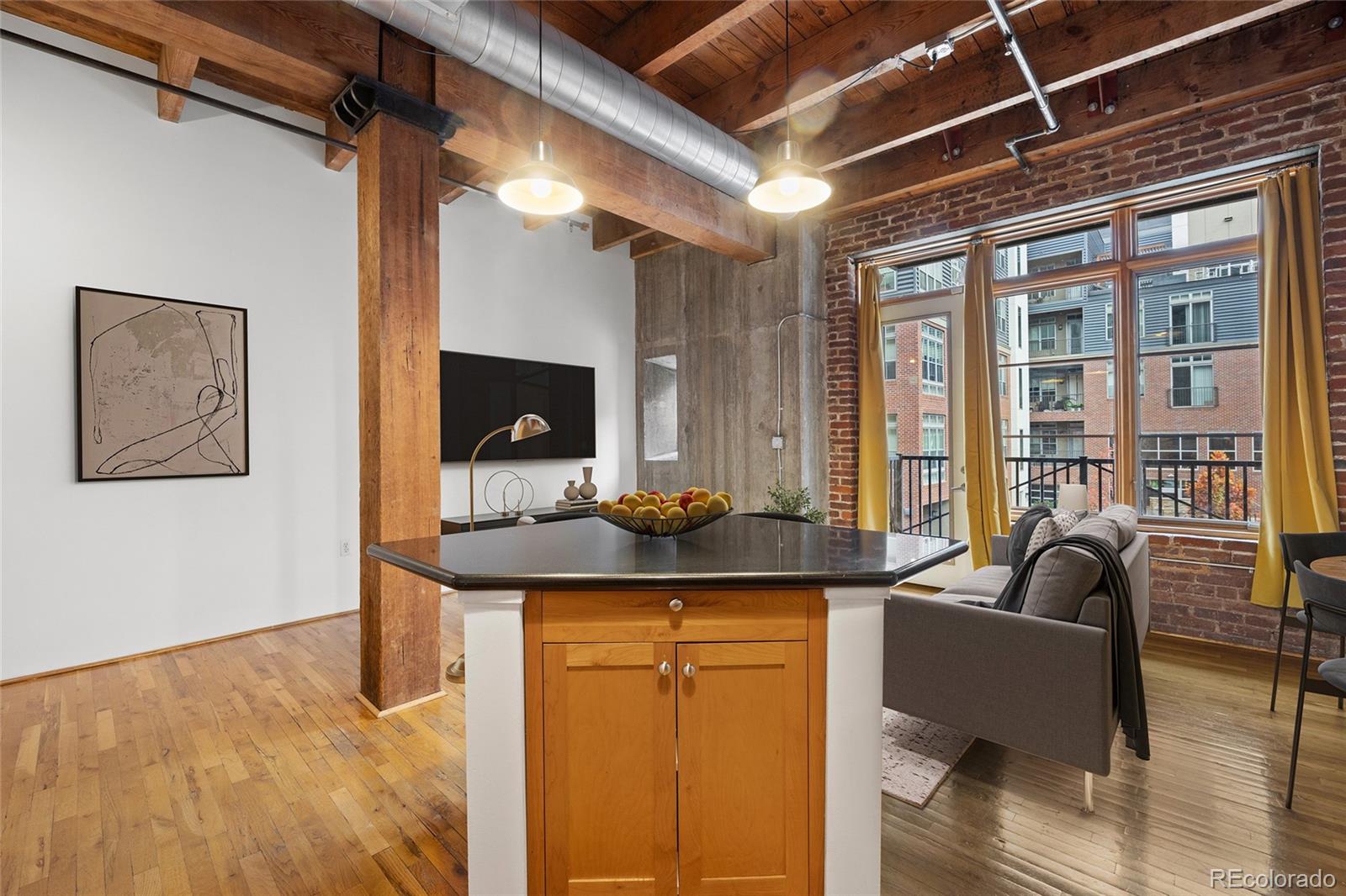 2960 Inca Street, Unit 208 Denver, CO 80202 - Photo 10 of 43 a kitchen with a sink and a refrigerator
