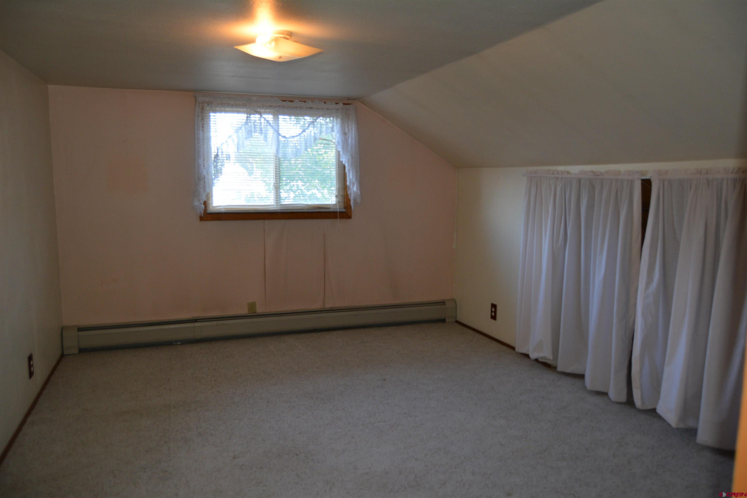 760 1575th Road Delta, CO 81416 - Photo 11 of 27 an empty room with a window