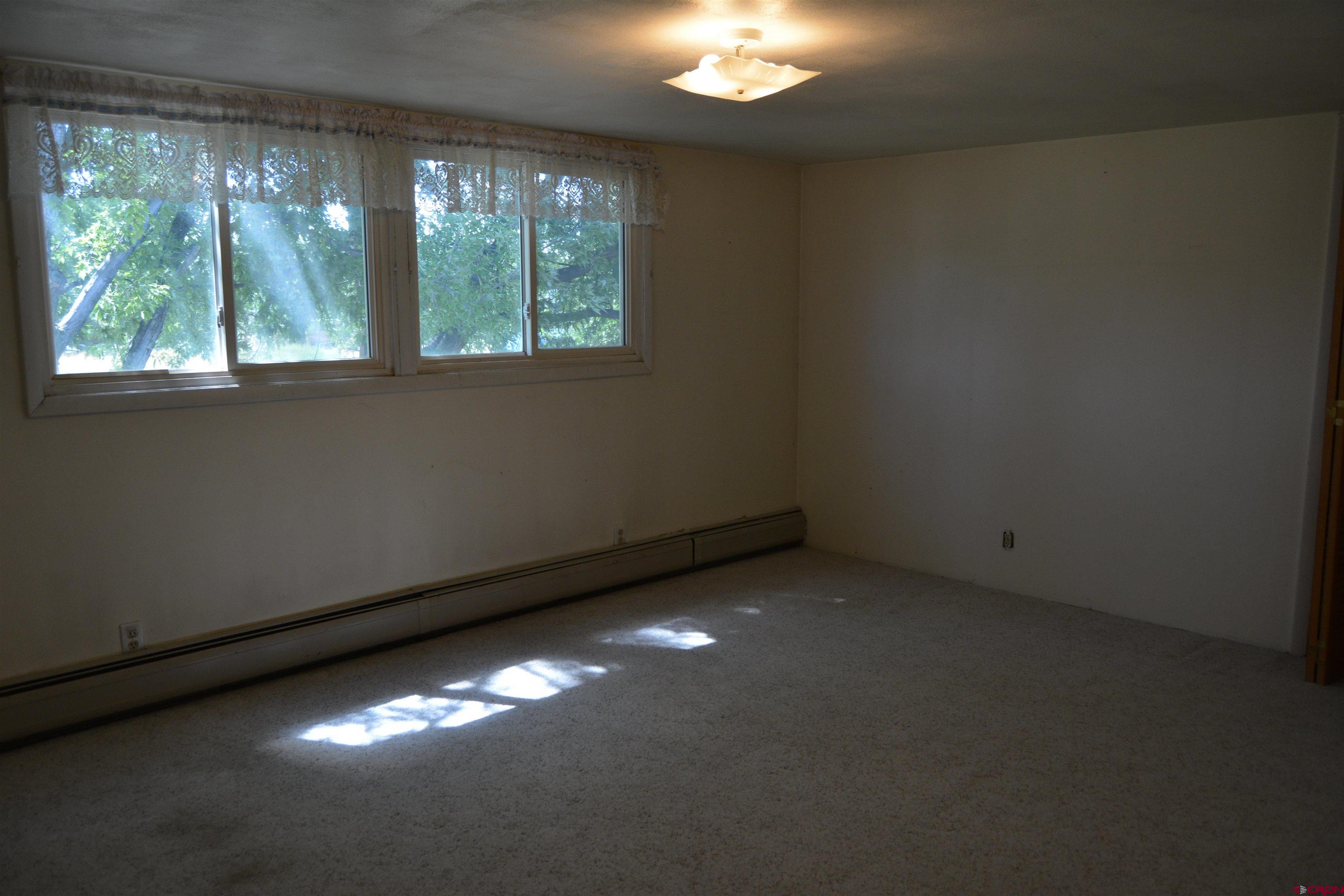 760 1575th Road Delta, CO 81416 - Photo 12 of 27 an empty room with a window