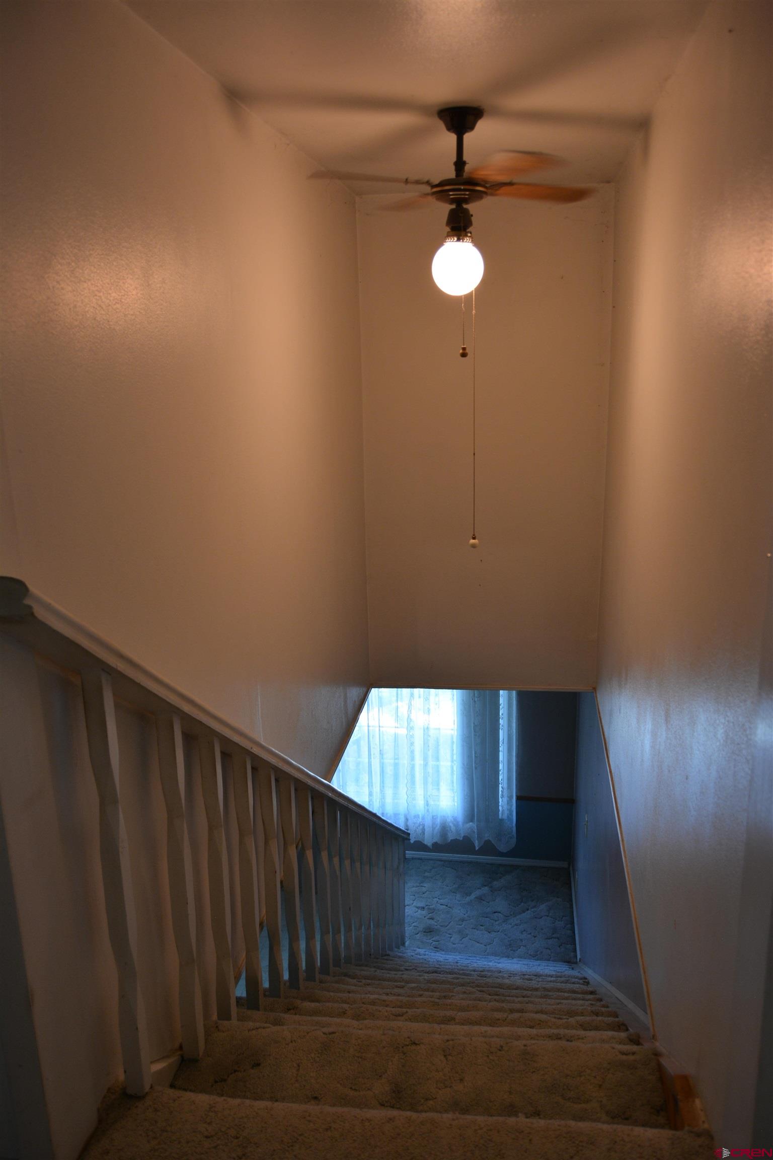 760 1575th Road Delta, CO 81416 - Photo 16 of 27 a view of staircase with wooden floor